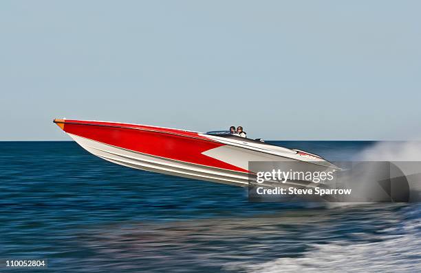 powerboat racing at high speed - boat on water stock-fotos und bilder