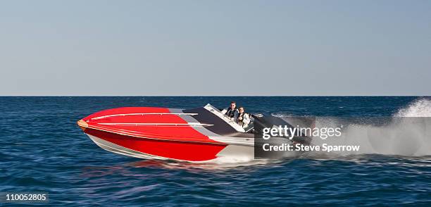 powerboat racing at high speed - power boat stock pictures, royalty-free photos & images