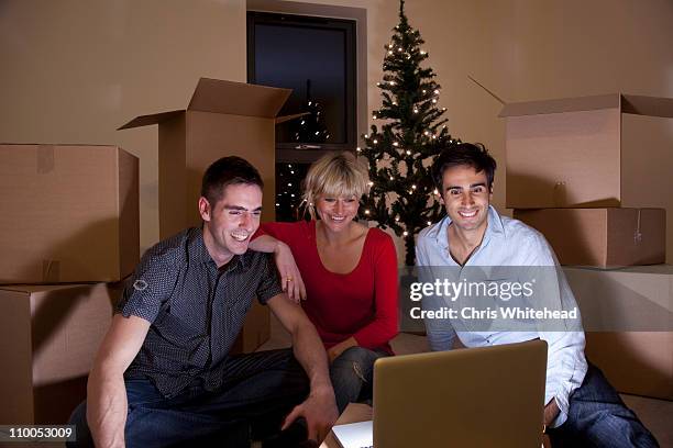 first night in apartment at christmas - christmas movie stock pictures, royalty-free photos & images