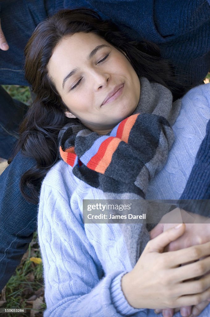 Girl resting on man's lap