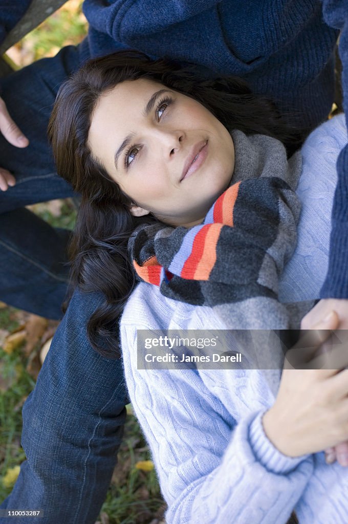 Girl resting head on man's lap