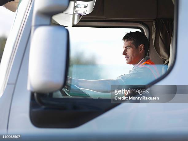truck driver in truck cab - flatbed truck stock-fotos und bilder