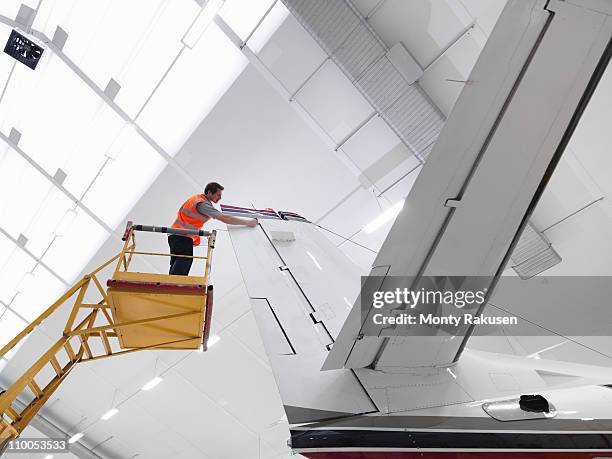 engineer inspects jet aircraft - aeroplane engineer stock pictures, royalty-free photos & images