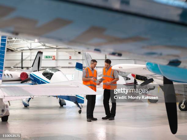 Engineers Inspect Turboprop Aircraft, Bildbanksbilder