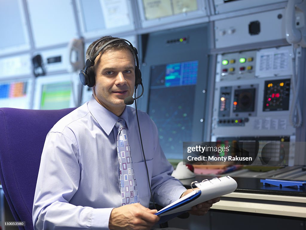 Air traffic controller in radar room