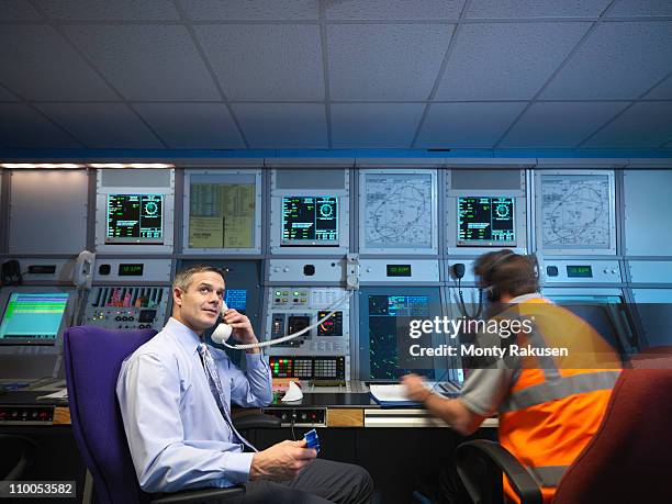 air traffic controllers in radar room - airport ground crew stock pictures, royalty-free photos & images