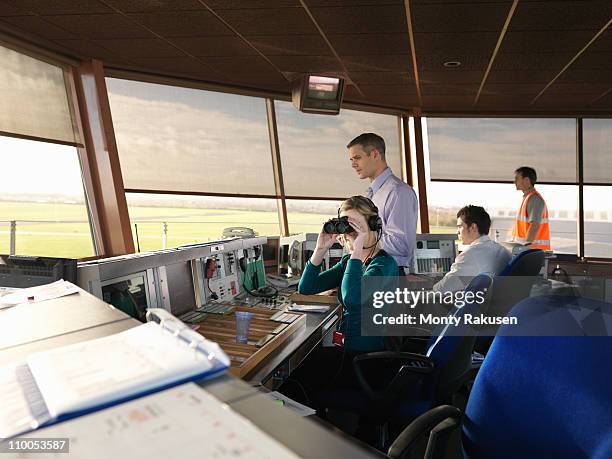 air traffic controllers in tower - air traffic control operator stock pictures, royalty-free photos & images