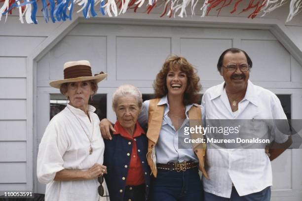 American actress Linda Gray on the set of the television soap opera 'Dallas', with her parents and an extra, 18th July 1979.