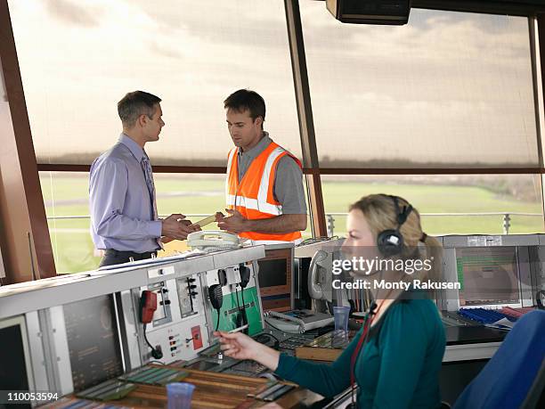 air traffic controllers in tower - torre di controllo foto e immagini stock