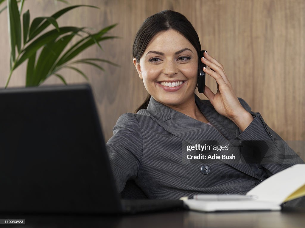 Business woman on the phone in office