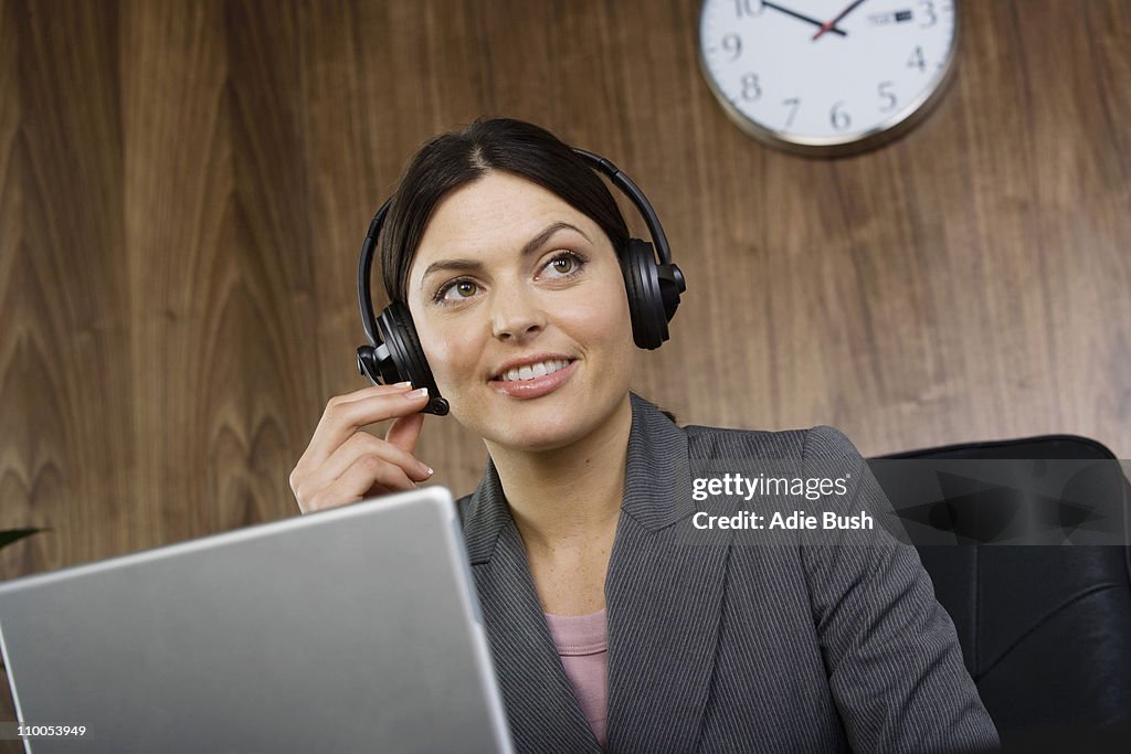 Business woman on telephone headset