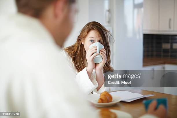 girl drinking coffee in kitchen - couple breakfast bildbanksfoton och bilder