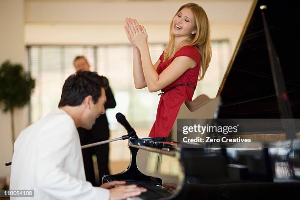 piano player and singing girl - pianist front stock pictures, royalty-free photos & images