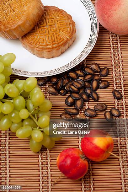 moon cakes with fresh fruit and seeds - porcelain melon stock pictures, royalty-free photos & images