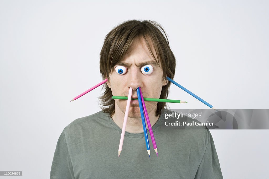 Bizarre man with pencils