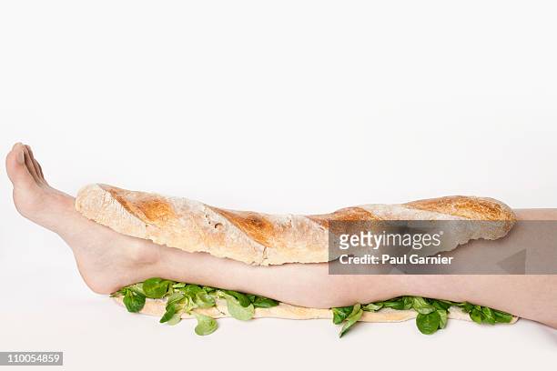 a submarine sandwich with a human leg in it - cannibalism stock pictures, royalty-free photos & images