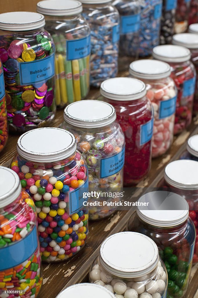Rows of candy jars in a candy store