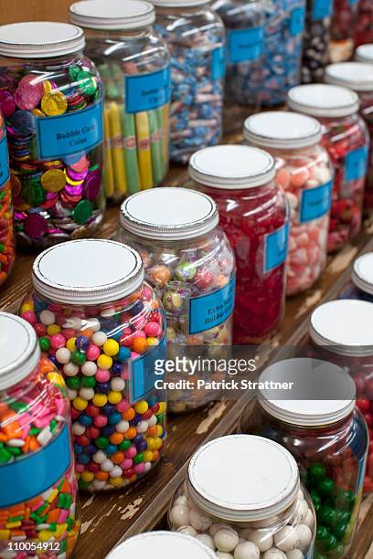 rows of candy jars in a candy store - boiled sweet stock pictures, royalty-free photos & images