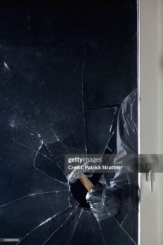 Break In Window A Criminal Breaking Into A Window Focus On Hand High-Res Stock Photo ...