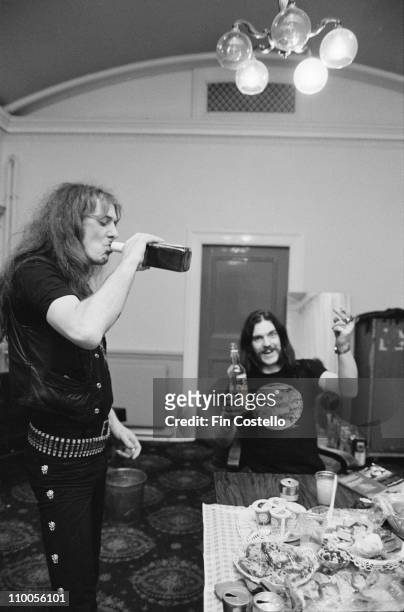 22nd MARCH: Fast Eddie Clarke and Lemmy Kilmister from Motorhead drinking whiskey and vodka backstage at City Hall in Newcastle on March 22nd 1982.