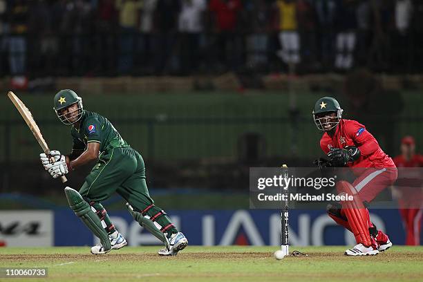 Asad Shafiq of Pakistan plays behind square as wicketkeeper Tatenda Taibu looks on during the Pakistan v Zimbabwe 2011 ICC World Cup Group A match at...