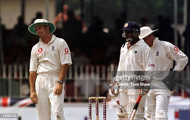 Aravinda De Silva of Sri Lanka looks on as Nasser Hussain of England looks forlorn as the appeal for his wicket was given not out the 1st day of the...