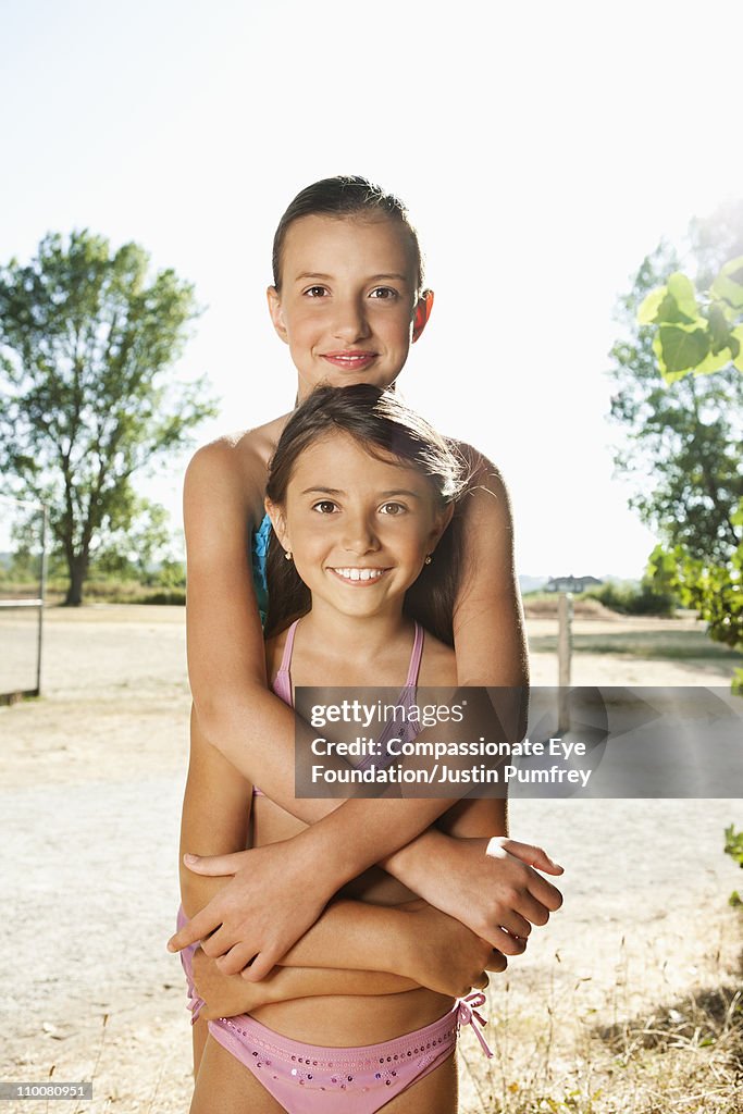 Portrait of two young girls in bathing suits