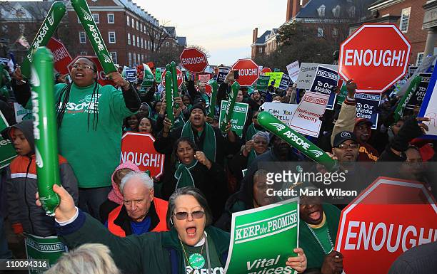 Members of the American Federation of State, County and Municipal Employees Union, participate in a rally in front of the Maryland State Capitol...