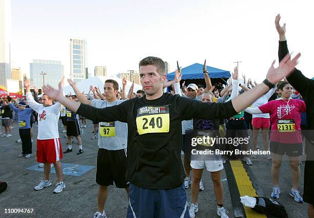 Runners warm up with Sergeant Ken at the Men's Health Urbanathlon on Saturday, October 20, 2007 at Grant Park in Chicago.