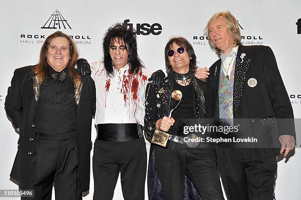 Michael Bruce, Alice Cooper, Dennis Dunaway and Neal Smith of Alice Cooper Band pose in the press room at the 26th annual Rock and Roll Hall of Fame...