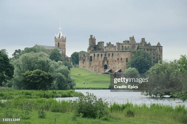 General view of the ruins of Linlithgow Palace, and St Michael's Church, West Lothian Scotland, July 1997. The palace was one of the principal...