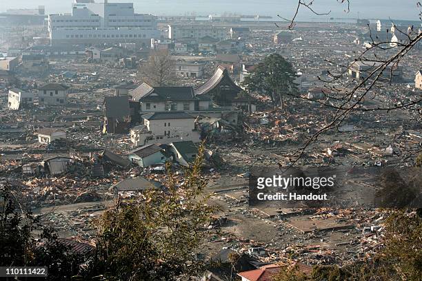 In this handout images provided by the International Federation of Red Cross Japan, A general view is seen of what is left of the city after a...