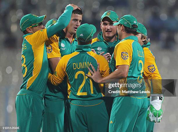 Morne Morkel of South Africa is congratulated on the wicket of William Porterfield of Ireland after he was caught by Graeme Smith during the 2011 ICC...