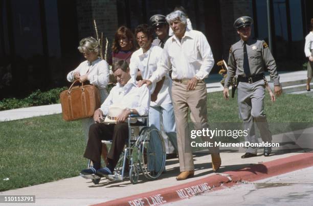 American actors Barbara Bel Geddes, Linda Gray, Larry Hagman and Jim Davis film a scene for the television soap opera 'Dallas', circa 1980.