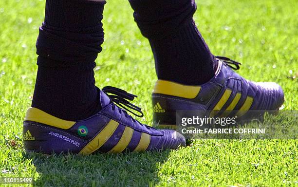 Shoes of the Brazilian national football team player Kaka on which are written "Jesus in first place" are pictured during a training on May 28, 2010...