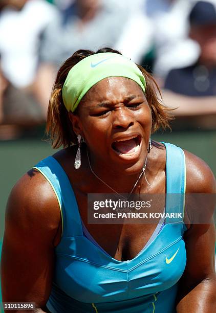 Serena Williams gestures during her women's first round match against Switzerland's Stefanie Voegele in the French Open tennis championship at the...