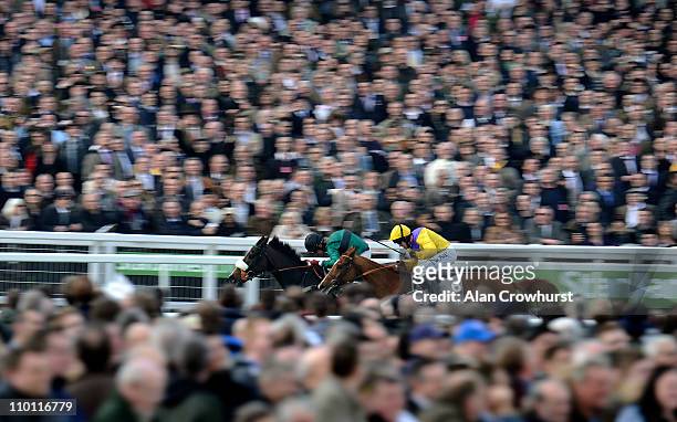 Robert Thornton riding Bensalem win The Stewart Family Spinal Research Handicap ChaseÊfrom Carole's Legacy at Cheltenham racecourse on Centenary Day,...