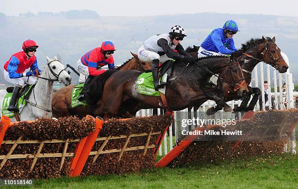 Ruby Walsh and Hurricane Fly jump the last fence on the first circuit on their way to victory in the Stan James Champion Hurdle Challenge Trophy at...