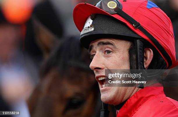 Ruby Walsh celebrates after winning the David Nicholson Mares' Hurdle Race on Quevega at Cheltenham Racecourse on March 15, 2011 in Cheltenham,...