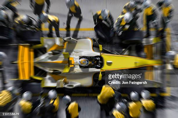 f1 pit crew working on f1 car. - pit stop stock pictures, royalty-free photos & images
