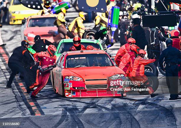 pit crew working on race car. - pitstop team stock pictures, royalty-free photos & images