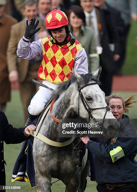 Graham Lee celebrates after winning the 5.15 Centenary Novices' Handicap Steeple Chase on Divers at Cheltenham Racecourse on March 15, 2011 in...