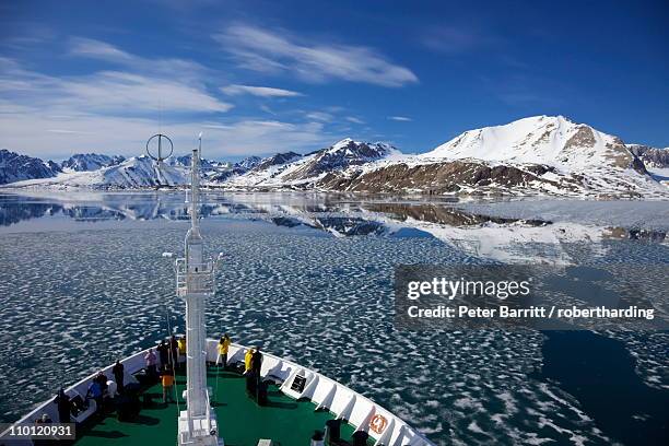 tourists on board arctic polar exploration cruise ship near monaco glacier in summer, liefdefjorden, spitzbergen, svalbard, norway, scandinavia, europe - spitsbergen stock pictures, royalty-free photos & images