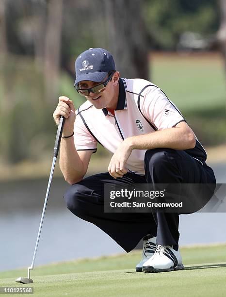 Justin Rose of England plays a shot on the 2nd hole during the second day of the Tavistock Cup at Isleworth Golf & Country Club on March 15, 2011 in...