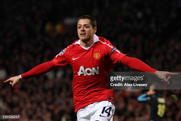 Javier Hernandez of Manchester United celebrates scoring the opening goal during the UEFA Champions League round of 16 second leg match between...