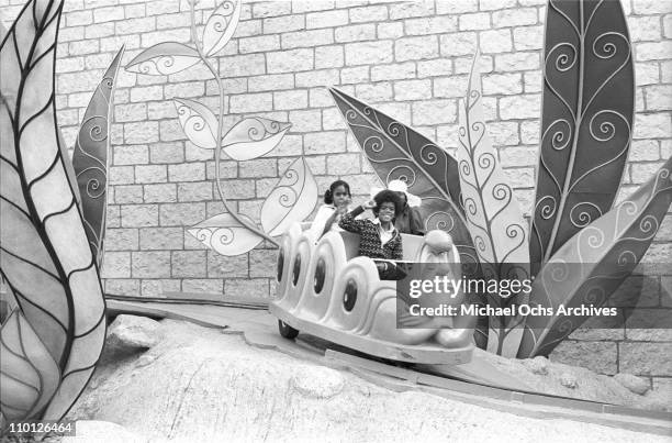 Foster Sylvers and Patricia Lynn Sylvers future members of the R and B group The Sylvers on the Alice In Wonderland ride at Disneyland on September...