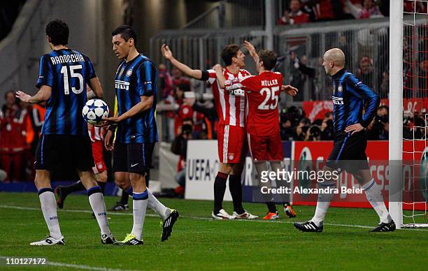 Mario Gomez of Bayern Muenchen celebrates his first goal with teammate Thomas Mueller as Andrea Ranocchia , Lucio and Esteban Cambiasso of Inter...