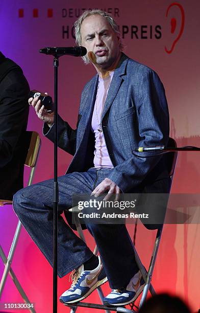 Actor and singer Uwe Ochsenknecht performs on stage during the 'Deutscher Hoerfilmpreis 2011' at the Atrium Deutsche Bank on March 15, 2011 in...