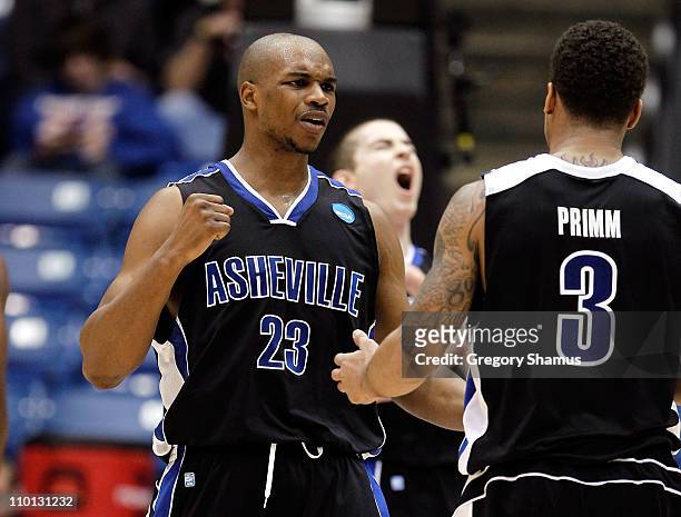John Williams and J.P. Primm of the North Carolina-Asheville Bulldogs celebrate after a play in the second half against the Arkansas Little Rock...