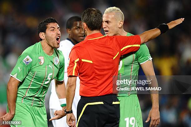 Algeria's defender Rafik Halliche and Algeria's midfielder Hassan Yebda yell at Referee Frank De Bleeckere during the Group C, first round, 2010...